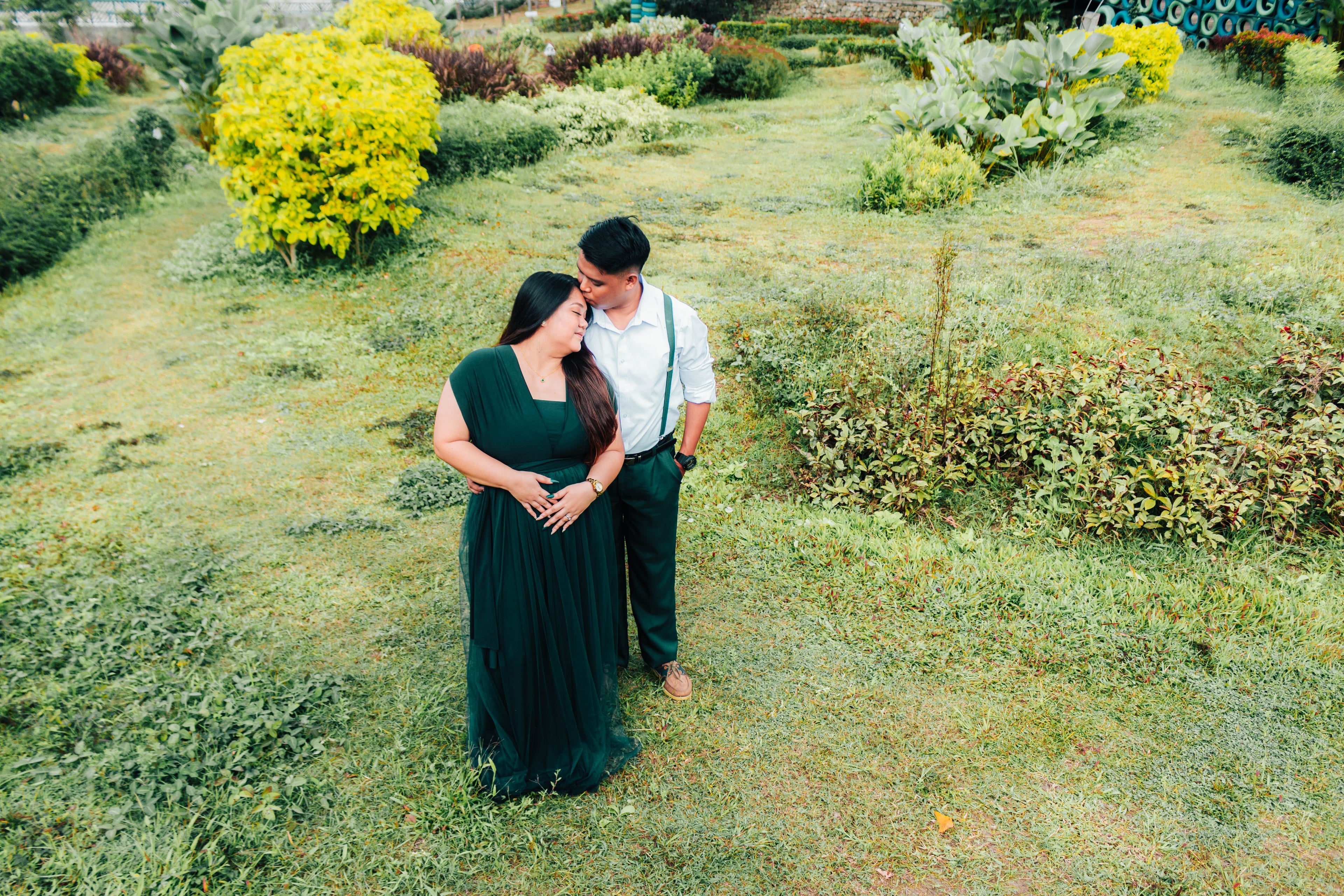 Anjo and Jasmin embracing in the garden, photographed from above