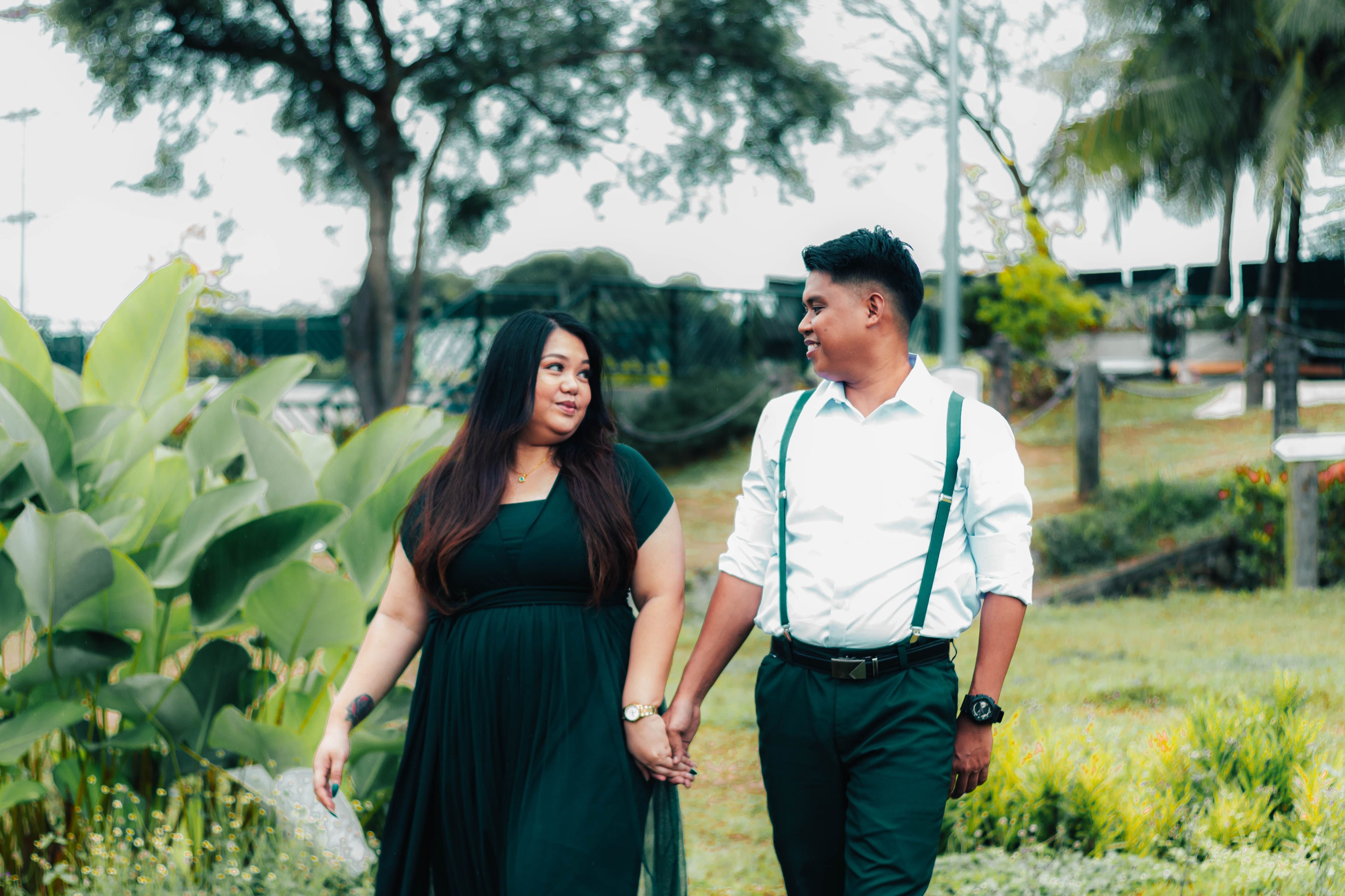 Anjo and Jasmin walking hand in hand in the garden